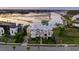 Stunning waterfront home with lush landscaping, elegant architecture, and a serene river view at twilight at 332 Bayley Rd, Daniel Island, SC 29492
