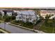 Beautiful home showcasing lush landscaping, a well-maintained lawn, and a view of the waterway at 332 Bayley Rd, Daniel Island, SC 29492