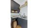 Stylish laundry area with ample storage, granite countertops, and modern sink and faucet at 332 Bayley Rd, Daniel Island, SC 29492