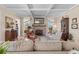 Comfortable and inviting living room featuring a fireplace, coffered ceiling, hardwood floors, and lots of seating at 332 Bayley Rd, Daniel Island, SC 29492