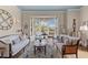 Cozy living room with beautiful decor, stylish furniture, a large window, and plenty of natural light at 332 Bayley Rd, Daniel Island, SC 29492