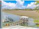 Beautiful marsh view from the home's window, including dock with boat at 332 Bayley Rd, Daniel Island, SC 29492