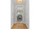 Open view of the office space featuring rich wood tones and plenty of natural light at 332 Bayley Rd, Daniel Island, SC 29492