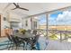 Inviting outdoor dining area with a built-in grill, comfortable seating, and scenic marsh views for relaxing at 332 Bayley Rd, Daniel Island, SC 29492