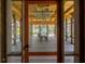 Interior of a screened pavilion featuring wood floors, vaulted ceilings and beautiful furnishings at 332 Bayley Rd, Daniel Island, SC 29492