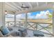 Inviting porch with comfortable seating and picturesque views of the tranquil waterfront at 332 Bayley Rd, Daniel Island, SC 29492