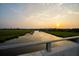 Scenic water view showcasing the tranquil marsh and waterway at sunset at 332 Bayley Rd, Daniel Island, SC 29492