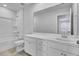 Bathroom featuring white vanity, large mirror, tub, and vinyl flooring at 332 Pine Crest View Dr, Summerville, SC 29486