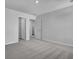 Bedroom showcasing neutral carpet, natural light, and two closets at 332 Pine Crest View Dr, Summerville, SC 29486