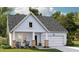 Charming single-story home with a welcoming front porch and manicured lawn at 332 Pine Crest View Dr, Summerville, SC 29486