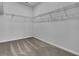 Spacious walk-in closet with wire shelving and neutral carpeting at 332 Pine Crest View Dr, Summerville, SC 29486