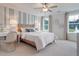 Cozy bedroom features soft carpeting, natural light from two windows, and stylish striped accent wall at 3585 Sawlog Dr, Summerville, SC 29486