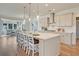 Bright kitchen showcases a large island with seating, pendant lighting, and stainless steel appliances at 3585 Sawlog Dr, Summerville, SC 29486