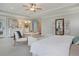 Bright main bedroom featuring a sitting area, balcony access, and ensuite bathroom for modern comfort and convenience at 3585 Sawlog Dr, Summerville, SC 29486