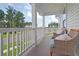 Relax on this charming front porch with comfortable seating, offering a perfect spot to enjoy the outdoors at 3585 Sawlog Dr, Summerville, SC 29486