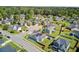Aerial view showcases a single-Gathering home with solar panels and a well-manicured lawn at 3801 Canary Ct, North Charleston, SC 29420