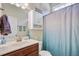Bathroom with white vanity sink, marble counter top and shower curtain at 3801 Canary Ct, North Charleston, SC 29420