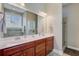 Bright bathroom features a double sink vanity with a large mirror and a glass enclosed shower at 3801 Canary Ct, North Charleston, SC 29420