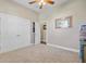 Bright bedroom features double door closet, neutral walls, and a ceiling fan at 3801 Canary Ct, North Charleston, SC 29420