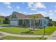 Attractive blue home featuring a lush front lawn and a welcoming porch, set on a corner lot at 3801 Canary Ct, North Charleston, SC 29420