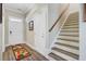 Foyer features stairs, stylish rug, hardwood floors, and natural light at 3801 Canary Ct, North Charleston, SC 29420