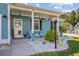 Inviting front porch featuring decorative elements, seating, and a colorful welcome sign at 3801 Canary Ct, North Charleston, SC 29420