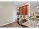 Bright kitchen featuring granite counters, stainless steel appliances, and wood-style flooring at 3801 Canary Ct, North Charleston, SC 29420