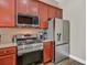 Modern kitchen with stainless steel appliances and wood cabinets at 3801 Canary Ct, North Charleston, SC 29420
