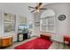 Cozy sunroom with a TV, ceiling fan, and natural light at 3801 Canary Ct, North Charleston, SC 29420
