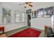 Bright sunroom with large windows, ceiling fan, and comfortable seating area at 3801 Canary Ct, North Charleston, SC 29420