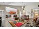 Open-concept living area featuring leather seating, a colorful rug, and easy access to the kitchen at 3801 Canary Ct, North Charleston, SC 29420