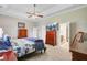 Spacious main bedroom with a ceiling fan, carpeted floors, and closet at 3801 Canary Ct, North Charleston, SC 29420