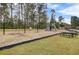Community playground with swings, slides, picnic area, and mature trees at 3801 Canary Ct, North Charleston, SC 29420
