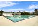 Community pool with white pergola and lounge area, perfect for relaxation at 3801 Canary Ct, North Charleston, SC 29420