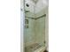 The tiled shower features glass doors and a built-in niche for storage at 3801 Canary Ct, North Charleston, SC 29420