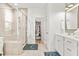 Bright bathroom featuring a glass shower, walk in closet and modern vanity at 383 Oak Park St, Summerville, SC 29486