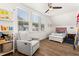 Cozy bedroom with a ceiling fan, hardwood floors, and bright natural light at 383 Oak Park St, Summerville, SC 29486