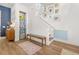 Light-filled entryway with stylish decor, hardwood floors, and staircase at 383 Oak Park St, Summerville, SC 29486