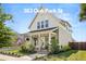 Charming two-story home with a quaint front porch and well-manicured landscaping at 383 Oak Park St, Summerville, SC 29486