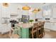 Bright and modern kitchen featuring a large center island with seating and stainless steel appliances at 383 Oak Park St, Summerville, SC 29486