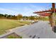 Picturesque pond view from a wooden deck, complemented by manicured lawns and trees in a serene community at 383 Oak Park St, Summerville, SC 29486