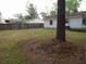 Large backyard with a wooden fence, providing privacy and ample space at 409 Robin Dr, Goose Creek, SC 29445