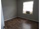 Bedroom with wood floors and a view from the window at 409 Robin Dr, Goose Creek, SC 29445