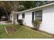 Charming single-story home with white brick exterior and well-maintained lawn at 409 Robin Dr, Goose Creek, SC 29445