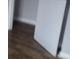 Showing a portion of a hallway with hardwood floors and a white door at 409 Robin Dr, Goose Creek, SC 29445