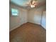 Cozy bedroom with a ceiling fan, neutral walls, and natural light coming from the window at 4324 Purdue Dr, North Charleston, SC 29418