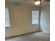 Neutral bedroom with carpet, two windows, a ceiling fan, and plenty of natural light at 4324 Purdue Dr, North Charleston, SC 29418