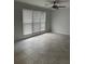 Spacious bedroom with three large windows and modern tile flooring at 4324 Purdue Dr, North Charleston, SC 29418