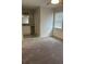 Bright bedroom featuring neutral carpeting, a ceiling fan, and an ensuite vanity area for added convenience at 4324 Purdue Dr, North Charleston, SC 29418