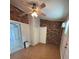 Bedroom featuring exposed brick accent walls and a ceiling fan at 4324 Purdue Dr, North Charleston, SC 29418